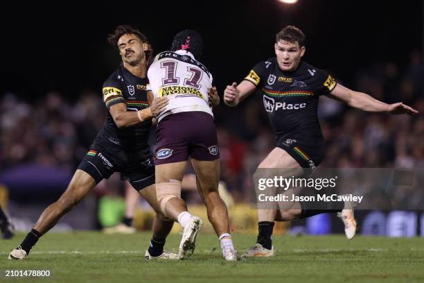 Brendan Piakura of the Broncos is tackled by Daine Laurie of the Panthers during the round three NRL match between Penrith Panthers and Brisbane...