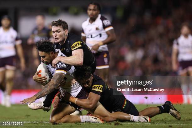 Jesse Arthars of the Broncos is tackled by Liam Martin of the Panthers during the round three NRL match between Penrith Panthers and Brisbane Broncos...