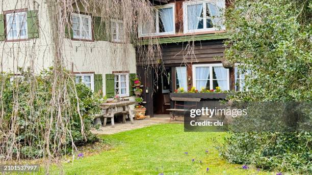 oberstdorf house and benches in front of it - oberstdorf stock pictures, royalty-free photos & images