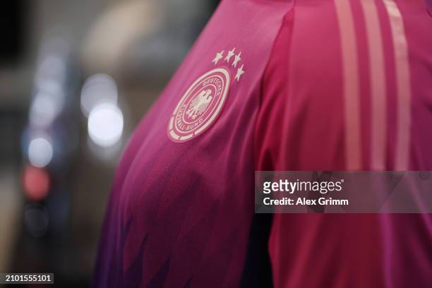 Detailed view of the DFB logo on the new pink away jersey during a press conference of the German national soccer team at DFB-Campus on March 21,...