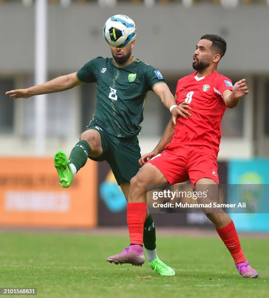 Rahis Nabi of team Pakistan and Ali Iyad of team Jordan compete for the ball during the 2026 FIFA World Cup Qualifiers second round Group G match...