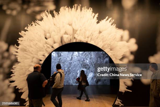 Visitors view an art installation during the Whitney Biennial, titled 'Even Better Than the Real Thing', at the Whitney Museum of American Art on...