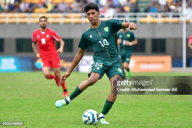 Muhammad Sadam of Pakistan kicks the ball during the 2026 FIFA World Cup Qualifiers second round Group G match between Pakistan and Jordan at Jinnah...