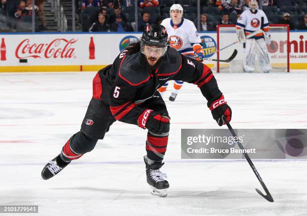 Jalen Chatfield of the Carolina Hurricanes skates against the New York Islanders at UBS Arena on March 19, 2024 in Elmont, New York.