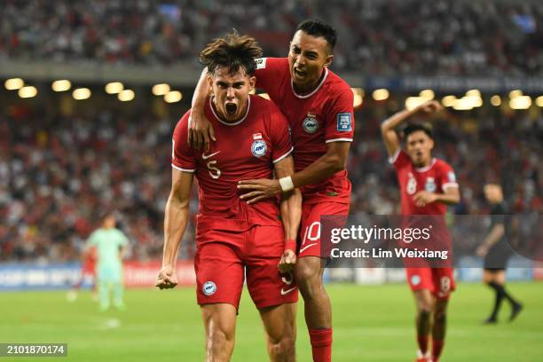Singapores Jacob Mahler celebrates after scoring his teams second goal in the FIFA World Cup Asian 2nd qualifier match between Singapore and China at...