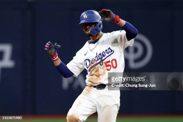 Mookie Betts of the Los Angeles Dodgers celebrates hitting an infield RBI single in the 8th inning during the 2024 Seoul Series game between San...