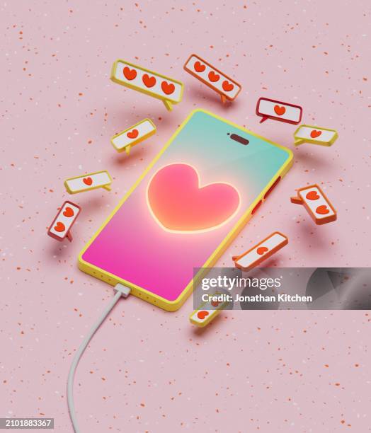 mobile phone with love symbols surrounding it with heart 3 - betrayal stock pictures, royalty-free photos & images