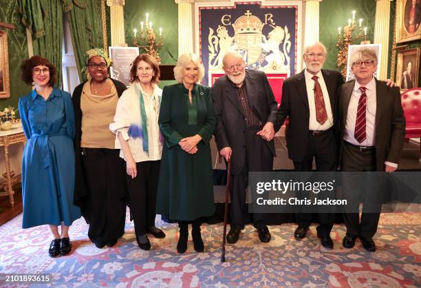 Queen Camilla poses with poets Sinead Morrissey, Raquel McKee, actress Frances Tomelty, poet Michael Longley, actor Ian McElhinney and poet Paul...