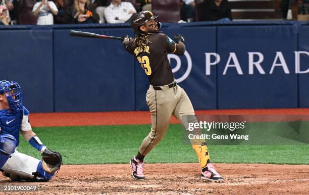 Fernando Tatis Jr of San Diego Padres hits a single in the top of the fifth inning during the 2024 Seoul Series game between Los Angeles Dodgers and...