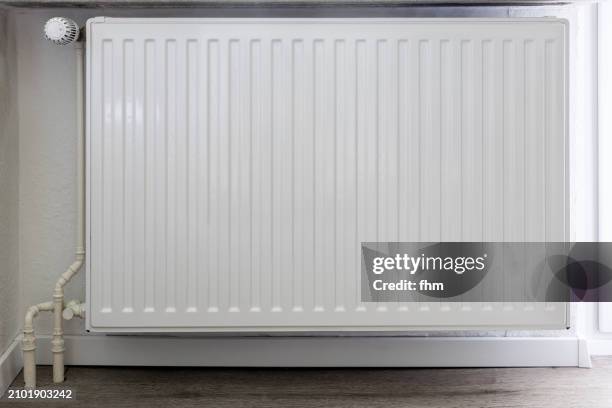 heating with thermostat on a wall - heizung stock-fotos und bilder