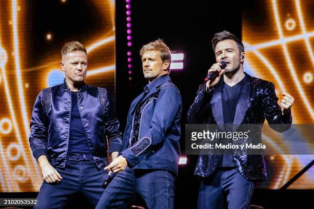 Nicky Byrne, Kian Egan and Shane Filan of Westlife boy band perform during a concert as part of The Wild Dreams Tour at Arena Monterrey on March 20,...