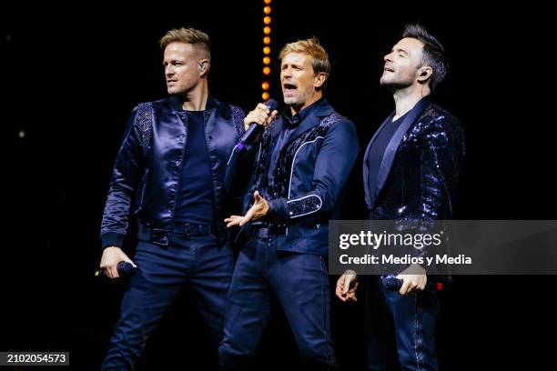 Nicky Byrne, Kian Egan and Shane Filan of Westlife boy band perform as part of The Wild Dreams Tour at Arena Monterrey on March 20, 2024 in...