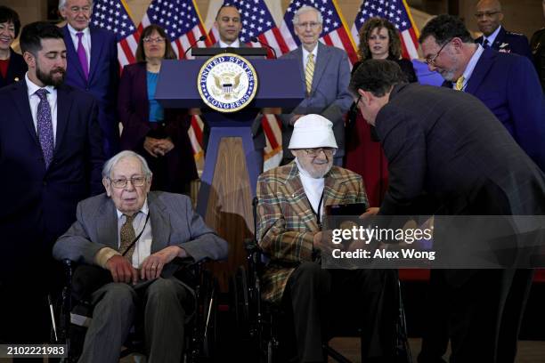 Speaker of the House Rep. Mike Johnson presents the Congressional Gold Medal to veteran of the Ghost Army Bernie Bluestein as fellow Ghost Army...