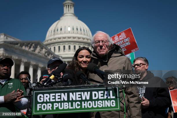 Sen. Bernie Sanders embraces Rep. Alexandria Ocasio-Cortez before speaking at a press conference outside the U.S. Capitol March 21, 2024 in...