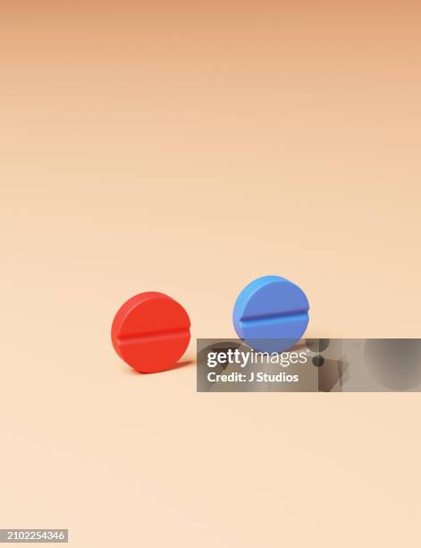 red and blue pills for choosing - conspiracy theory stock pictures, royalty-free photos & images
