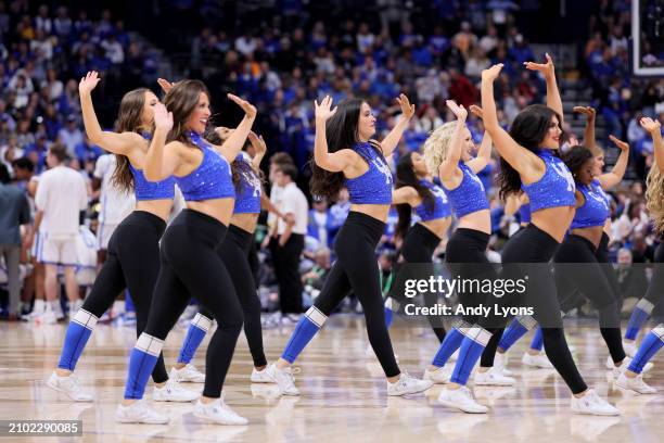 Kentucky Wildcats cheerleaders perform in the game against the Texas A&M Aggies during the quarterfinals of the SEC Basketball Tournament at...