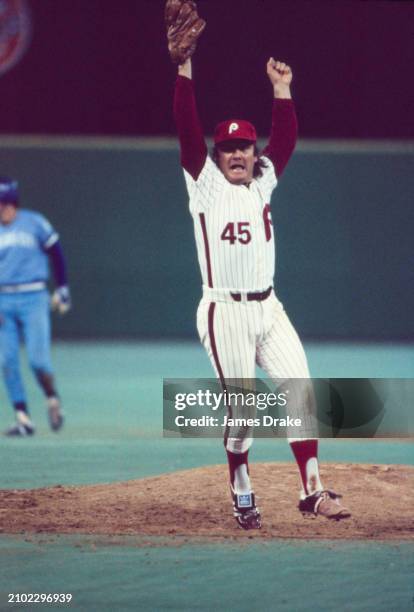 Philadelphia Phillies pitcher Tug McGraw celebrates on the mound after striking out the final Kansas City Royals batter with bases-loaded to win the...