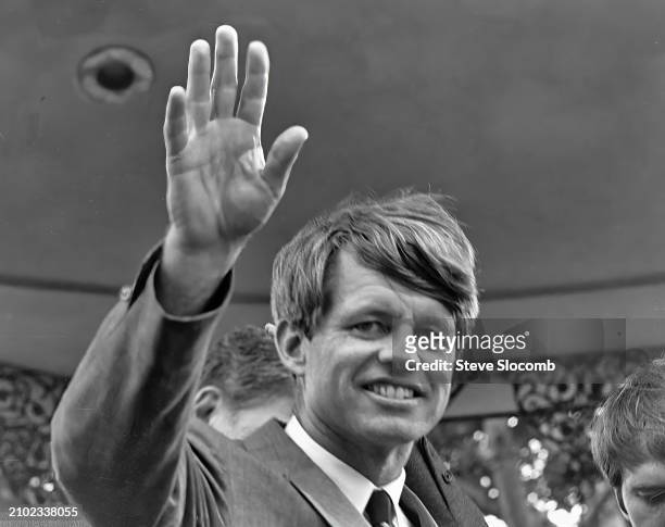 Senator and forrmer Attorney General Robert F Kennedy waves during a presidential campaign rally on Olvera Street at the El Pueblo de Los Angeles...