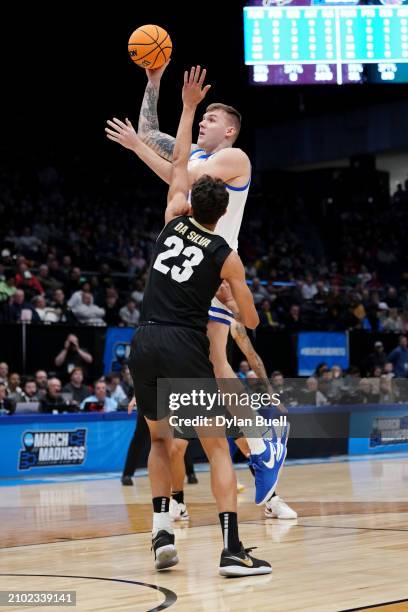 Cam Martin of the Boise State Broncos attempts a shot while being guarded by Tristan da Silva of the Colorado Buffaloes in the first half in the...