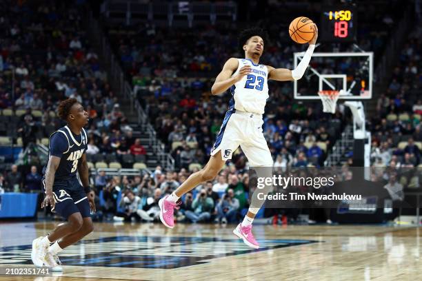 Trey Alexander of the Creighton Bluejays reaches for a pass in the first half as Kaleb Thornton of the Akron Zips defends in the first round of the...