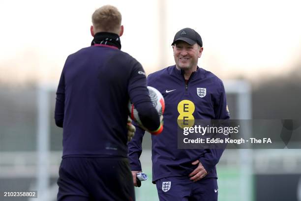 Steve Holland and Aaron Ramsdale of England talk during a training session at St George's Park on March 21, 2024 in Burton upon Trent, England.