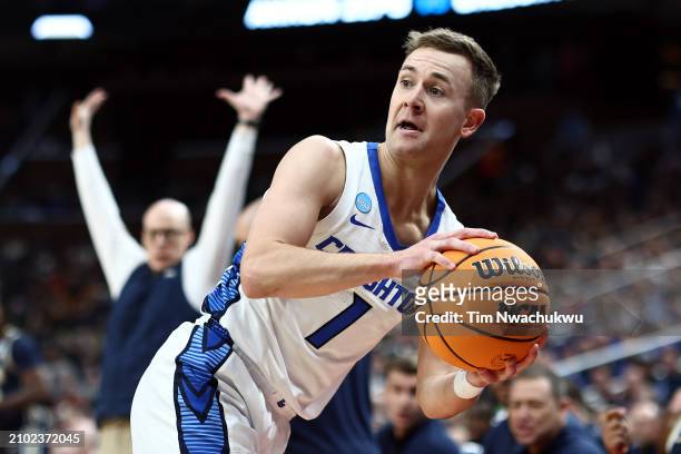 Steven Ashworth of the Creighton Bluejays looks to pass against the Akron Zips in the first half in the first round of the NCAA Men's Basketball...