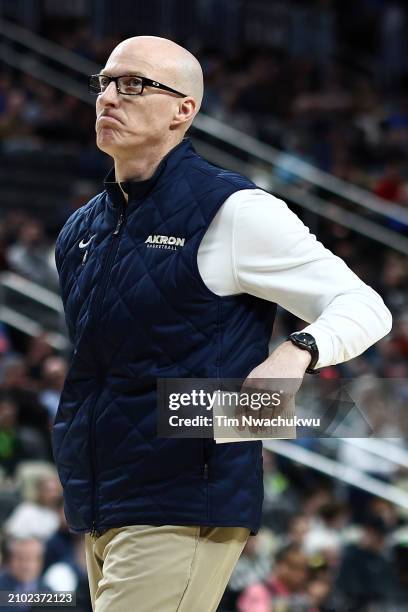 Head coach John Groce of the Akron Zips looks on in the first half against the Creighton Bluejays in the first round of the NCAA Men's Basketball...