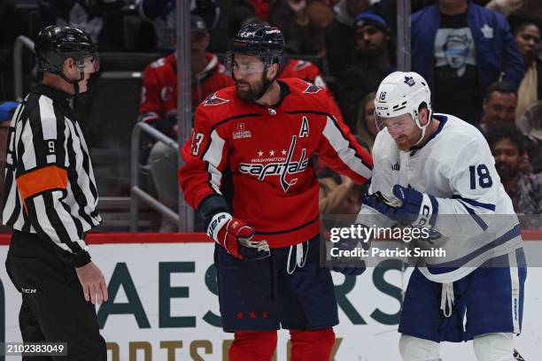 Tom Wilson of the Washington Capitals reacts after he committed a high-sticking penalty on Noah Gregor of the Toronto Maple Leafs during the third...