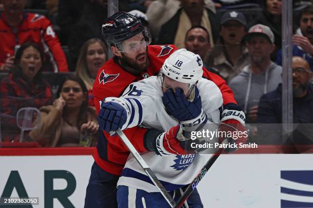 Tom Wilson of the Washington Capitals reacts after he committed a high-sticking penalty on Noah Gregor of the Toronto Maple Leafs during the third...