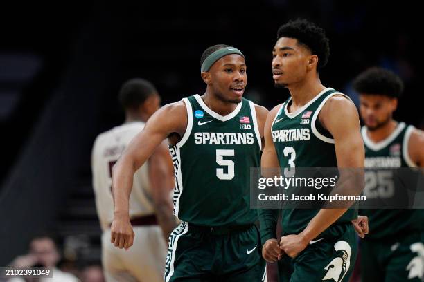 Tre Holloman and Jaden Akins of the Michigan State Spartans celebrate a basket against the Mississippi State Bulldogs during the second half in the...