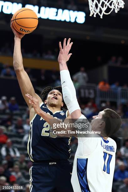 Enrique Freeman of the Akron Zips goes up for a shot against Ryan Kalkbrenner of the Creighton Bluejays in the second half in the first round of the...