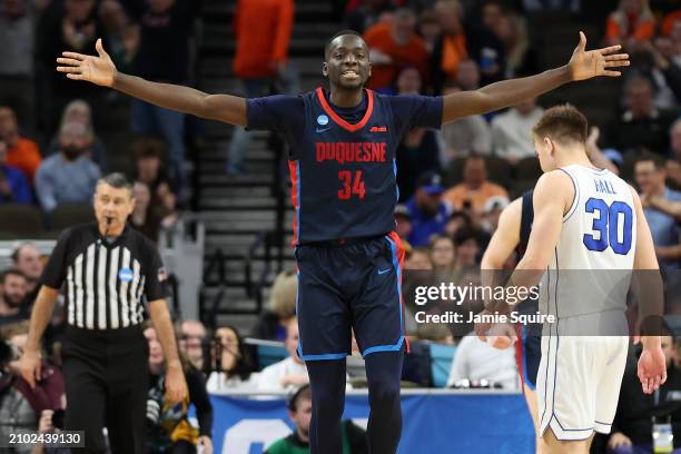 Fousseyni Drame of the Duquesne Dukes reacts after defeating the Brigham Young Cougars during the second half in the first round of the NCAA Men's...
