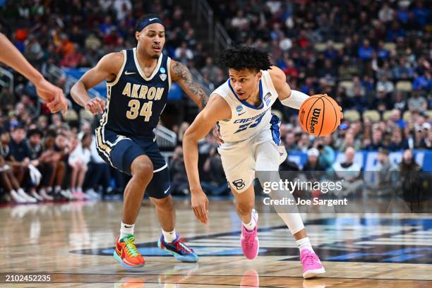 Trey Alexander of the Creighton Bluejays drives to the basket against Nate Johnson of the Akron Zips in the second half in the first round of the...