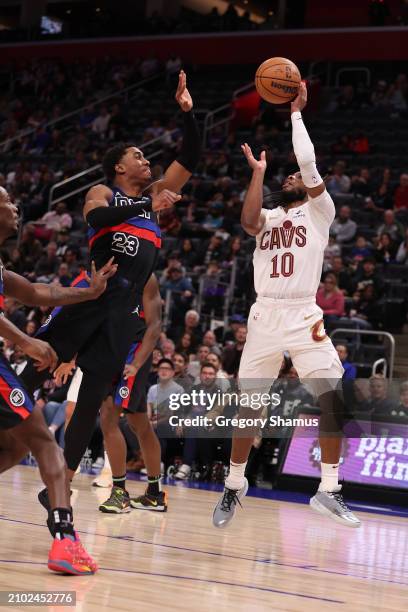 Jaden Ivey of the Detroit Pistons blocks the shot of Darius Garland of the Cleveland Cavaliers at Little Caesars Arena on March 01, 2024 in Detroit,...