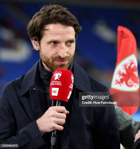 Joe Allen ex international Wales waits to comment on the UEFA EURO 2024 Play-Offs Semi-final between Wales and Finland at Cardiff City Stadium on...