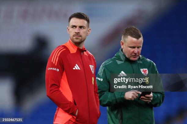 Aaron Ramsey of Wales inspects the pitch prior to the UEFA EURO 2024 Play-Offs Semi-final match between Wales and Finland at Cardiff City Stadium on...