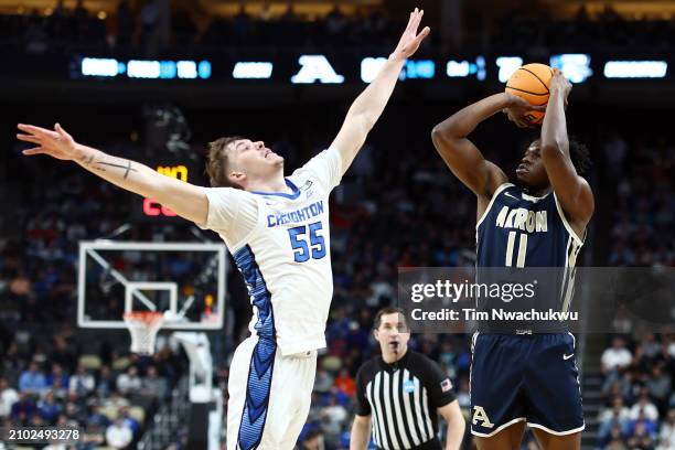 Sammy Hunter of the Akron Zips takes a shot in the second half as Baylor Scheierman of the Creighton Bluejays defends in the first round of the NCAA...