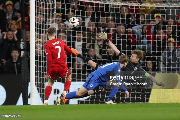 David Brooks of Wales scores his team's first goal past Lukas Hradecky of Finland during the UEFA EURO 2024 Play-Offs Semi-final match between Wales...
