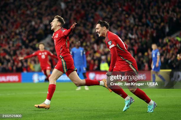 David Brooks of Wales celebrates scoring his team's first goal during the UEFA EURO 2024 Play-Offs Semi-final match between Wales and Finland at...