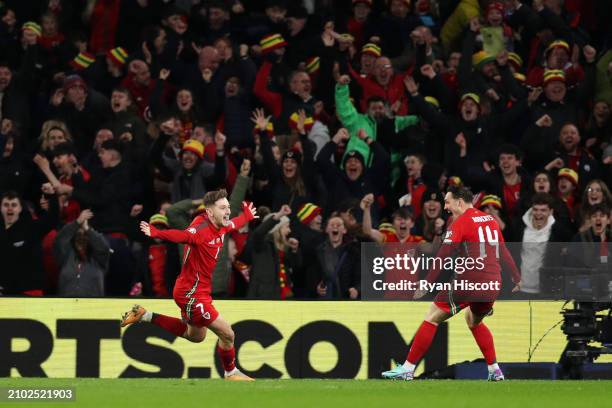 David Brooks of Wales celebrates scoring his team's first goal during the UEFA EURO 2024 Play-Offs Semi-final match between Wales and Finland at...