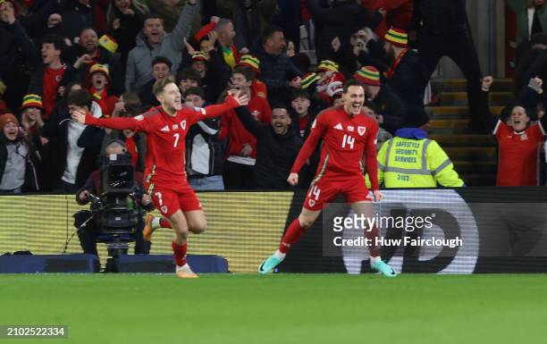 David Brooks of Wales celebrates scoring a goal during the UEFA EURO 2024 Play-Offs Semi-final between Wales and Finland at Cardiff City Stadium on...