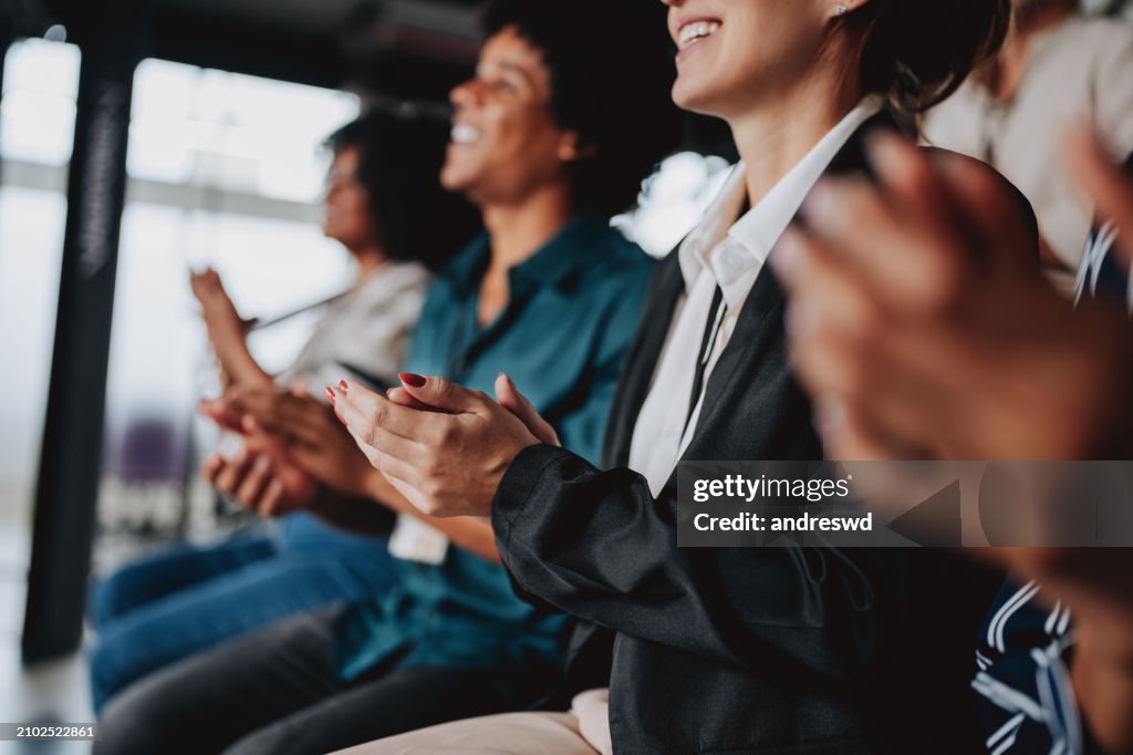 Group of people applauding