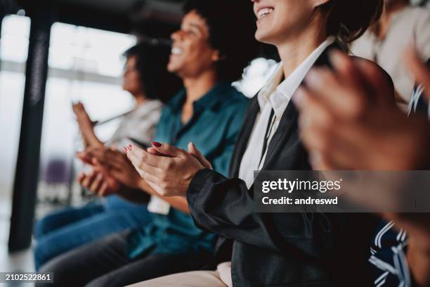 group of people applauding - congratulating stock pictures, royalty-free photos & images