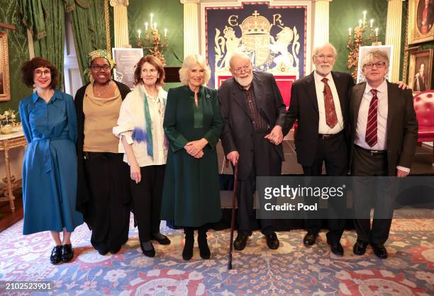Queen Camilla poses with poets Sinead Morrissey, Raquel McKee, actress Frances Tomelty, poet Michael Longley, actor Ian McElhinney and poet Paul...