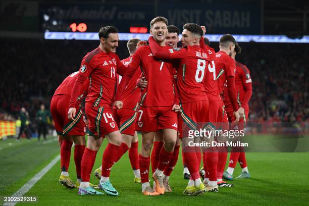 David Brooks of Wales celebrates scoring his team's first goal with Connor Roberts, Harry Wilson and team mates during the UEFA EURO 2024 Play-Offs...