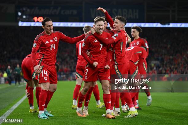 David Brooks of Wales celebrates scoring his team's first goal with Connor Roberts, Harry Wilson and team mates during the UEFA EURO 2024 Play-Offs...