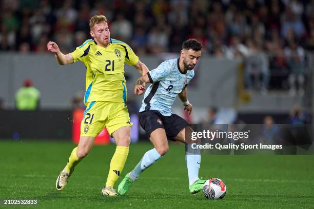 Dejan Kulusevski of Sweden competes for the ball with Bruno Fernandes of Portugal during the international friendly match between Portugal and Sweden...