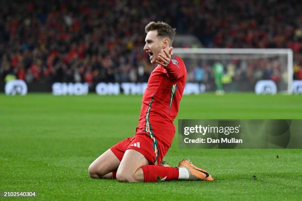David Brooks of Wales celebrates scoring his team's first goal during the UEFA EURO 2024 Play-Offs Semi-final match between Wales and Finland at...