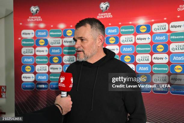 Willy Sagnol, Head Coach of Georgia, speaks to the media after the UEFA EURO 2024 Play-Offs semifinal match between Georgia and Luxembourg at Boris...