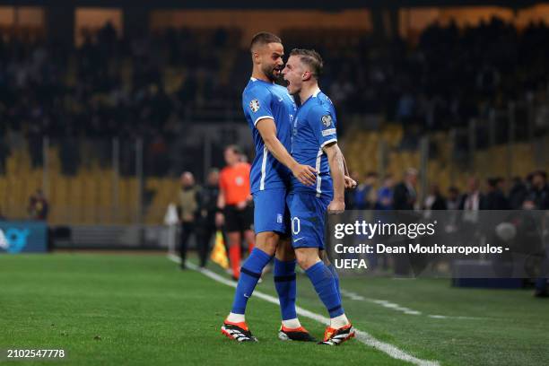 Dimitris Pelkas of Greece celebrates scoring his team's second goal with teammate Pantelis Hatzidiakos during the UEFA EURO 2024 Play-Offs semifinal...